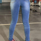 Back view of Bella Road Denim Skinny Jeans showcasing pockets and stylish medium wash, perfect for practical fashion.