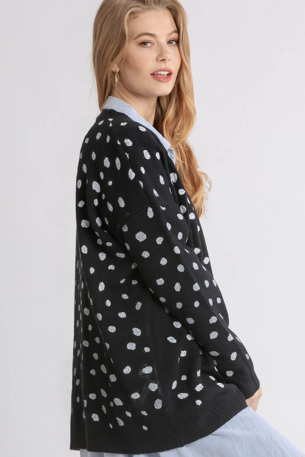 Stylish Umgee polka dot open front drop shoulder cardigan in black, perfect for layering and all-day comfort.