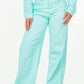 American Bazi high waist distressed wide leg jeans in mint green, perfect for a trendy, chic outfit.