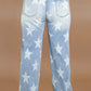 Woman wearing Bella Road Plus Size Star Straight Leg Jeans with Pockets, showcasing back view with star pattern design.