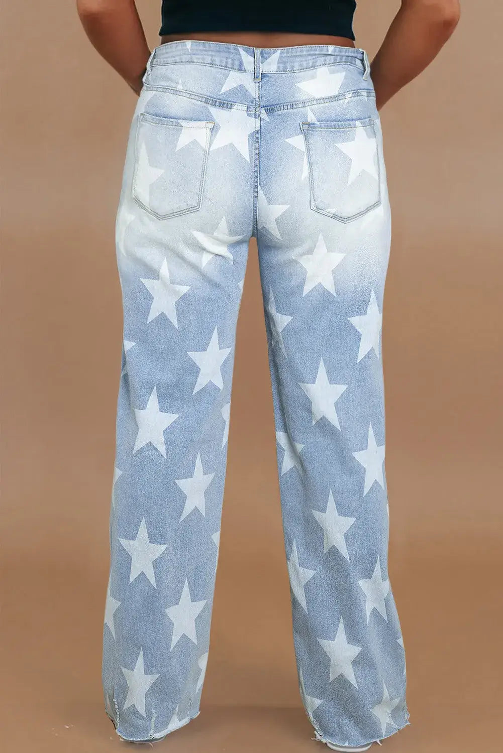 Woman wearing Bella Road Plus Size Star Straight Leg Jeans with Pockets, showcasing back view with star pattern design.