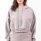 Trendy American Bazi 'Los Angeles' cropped hoodie in soft beige, featuring a drawstring detail and front pocket.