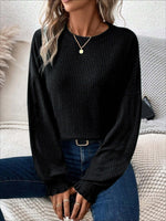 Woman wearing Bella Road Ribbed Round Neck Lantern Sleeve T-Shirt in black with jeans and jewelry