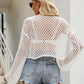 Woman wearing Openwork Round Neck Long Sleeve Cover-Up with denim shorts, showing back view outdoors.