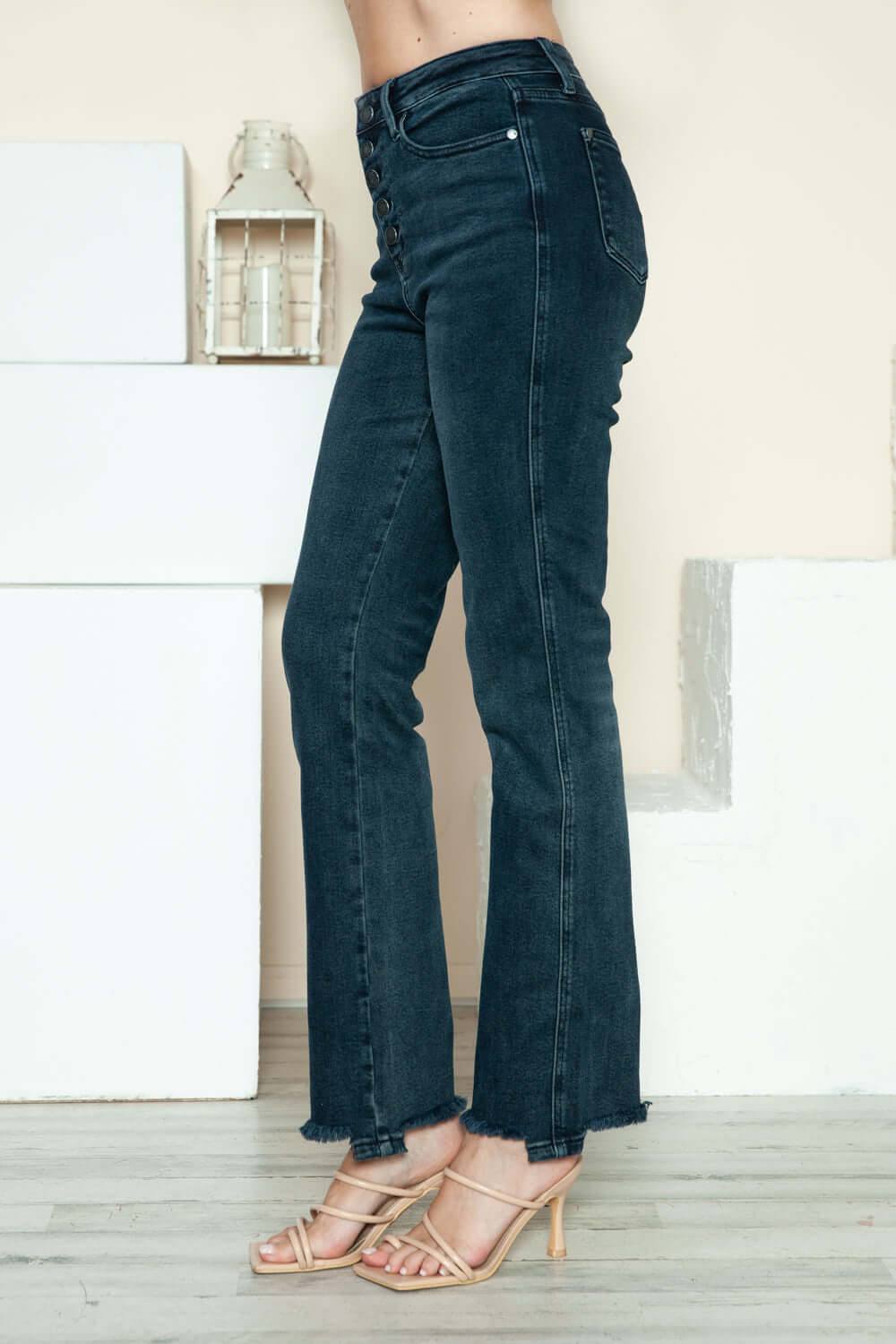 Judy Blue full size button fly straight jeans with distressed hem, featuring a modern design and stylish button closure.