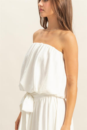 Model showcasing a stylish HYFVE bubble hem tube top in white, perfect for warm weather and versatile styling.