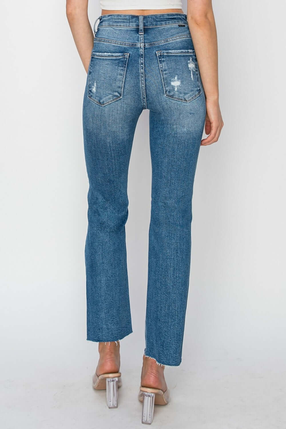 Trendy high rise distressed ankle jeans by Risen Jeans, perfect for a stylish look with a flattering fit and versatile ankle length.