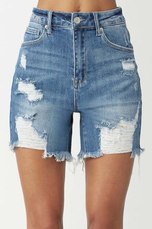 Distressed high waisted denim shorts by Risen Jeans showing edgy and casual summer fashion.