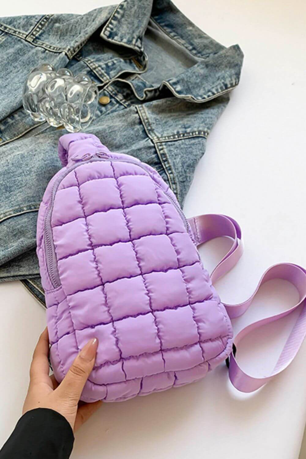 Lavender quilted nylon crossbody bag on denim jacket – stylish, lightweight, and perfect for adventures.