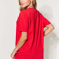 Woman wearing a red graphic round neck short sleeve t-shirt viewed from the back showing the relaxed fit.