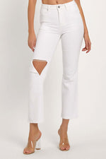 White distressed cropped straight jeans with ripped knee, perfect for showcasing footwear, offering an edgy and casual vibe.