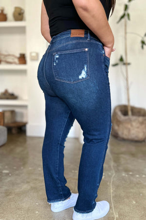 Woman wearing High Waist Rigid Magic Heavy Destroy Straight Judy Blue Jeans, showing back view with heavy distressing details.