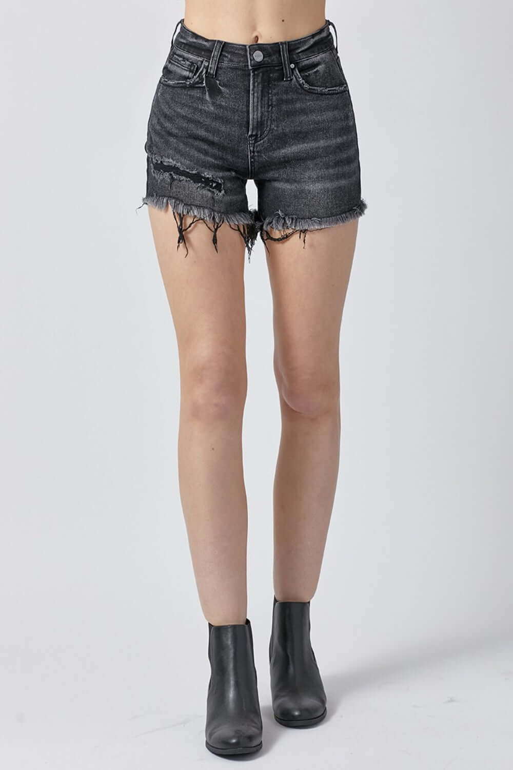 Raw hem denim shorts with pockets by Risen Jeans, perfect for a casual, summer look with versatile styling options.