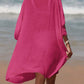 Woman wearing pink cutout V-neck three-quarter sleeve cover up on a beach