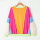 Bella Road Color Block Round Neck Long Sleeve Top with vibrant colors on a hanger.