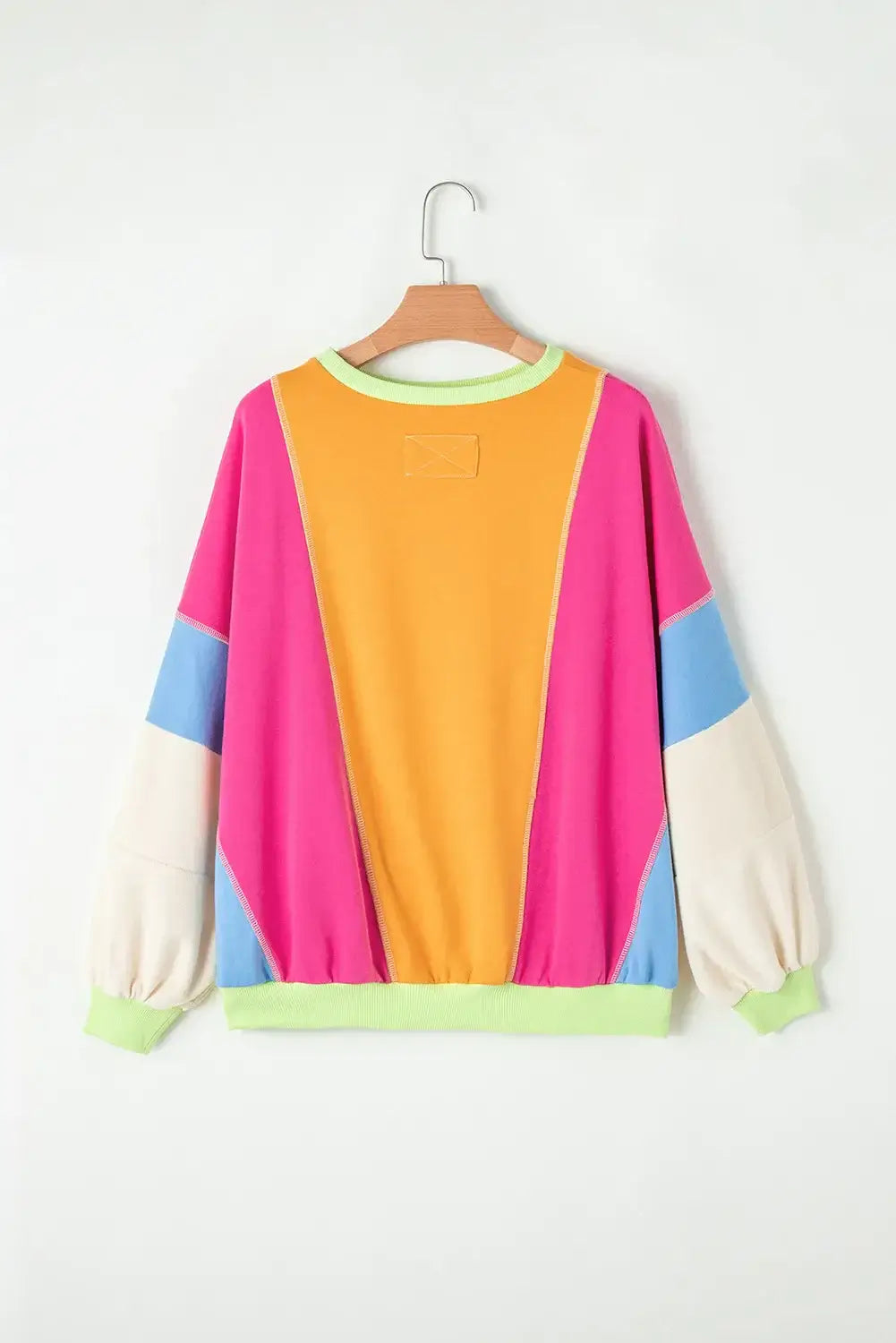 Bella Road Color Block Round Neck Long Sleeve Top with vibrant colors on a hanger.