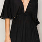 Black tie back maxi split cover-up dress with plunging neck, batwing sleeves, cinched waist, flowy skirt, and long side slits.