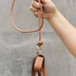 Nicole Lee USA Vegan Leather 3-Piece Lanyard Set held by a hand against a gray background