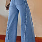 Back view of Bella Road Raw Hem Wide Leg Jeans with Pockets showing stylish raw hem and wide leg design