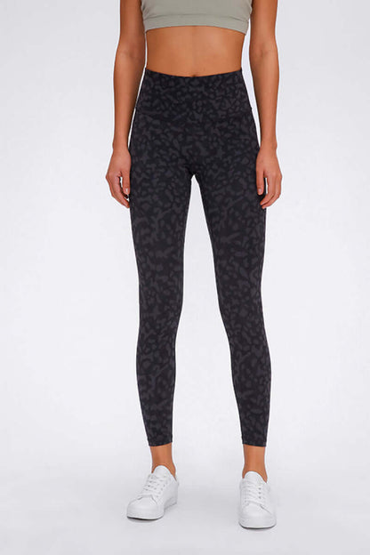 Stylish woman in wide seamless band waist sports leggings, perfect for workouts and adventures.