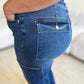 Close-up of Judy Blue High Waist Straight Cargo Jeans with side pocket detailing in blue denim.