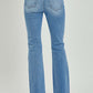 Back view of RISEN high rise button fly bootcut jeans showcasing flattering fit and vintage style in comfortable denim.