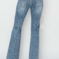 Back view of mid-rise bootcut Risen Jeans, showing a balanced silhouette and flattering style paired with black heels.