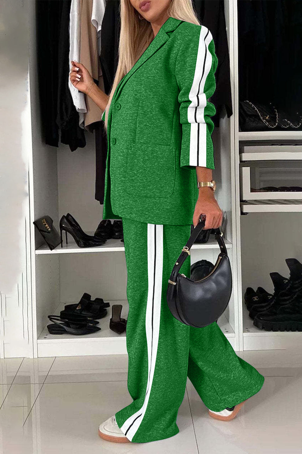 Stylish woman in green contrast lapel collar top and pants set, showcasing a chic two-piece outfit with a modern vibe.