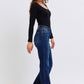 Stylish woman in Judy Blue raw hem straight leg jeans, side view showcasing timeless style and flattering fit.