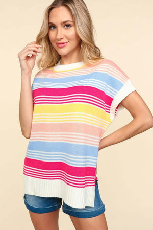 Woman wearing Striped Side Slit Short Sleeve Knit Top in colorful pattern paired with denim shorts