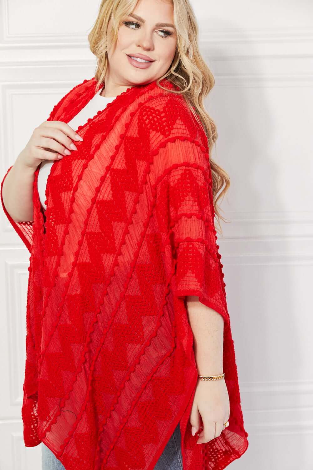 JUSTIN TAYLOR Pom-Pom Asymmetrical Poncho Cardigan in Red at Bella Road