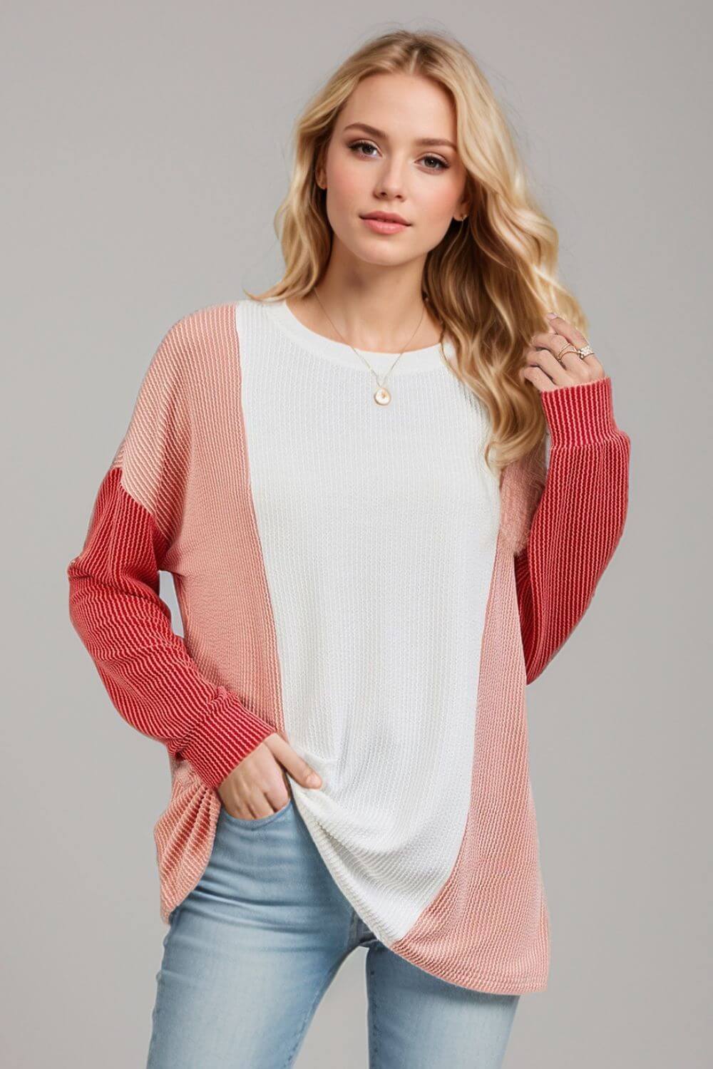 Woman wearing Double Take Texture Contrast Round Neck Long Sleeve T-Shirt in trendy color combo, perfect for layering.