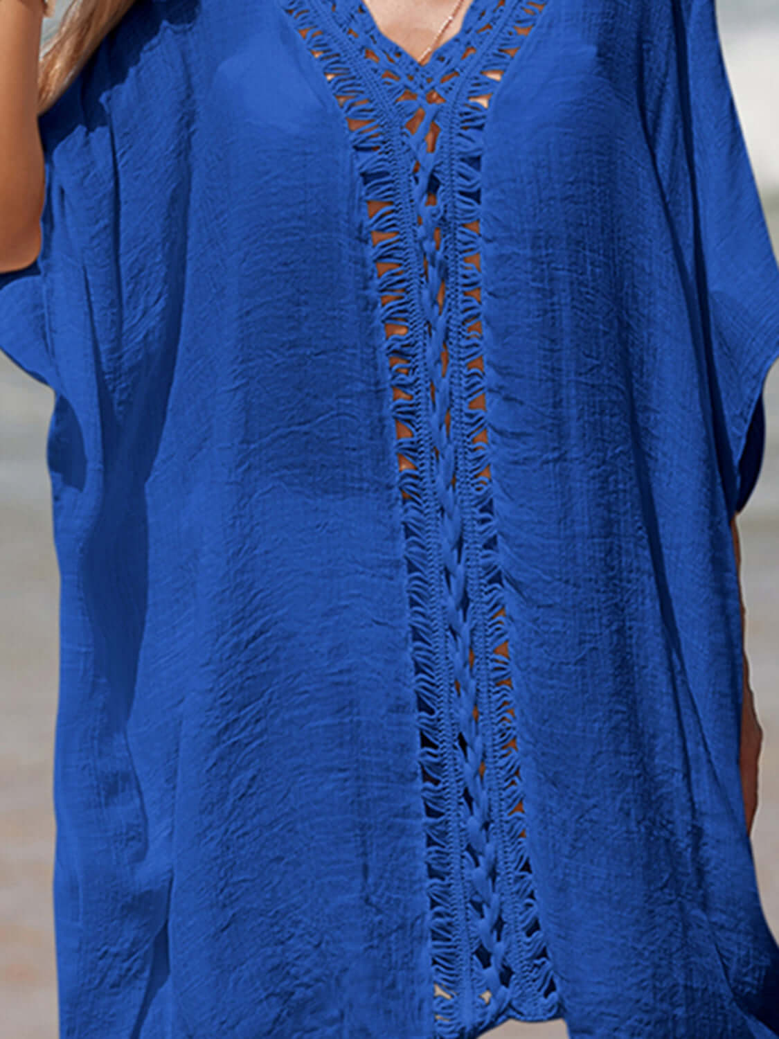 Blue cutout V-neck three-quarter sleeve cover-up with openwork sheer design, made of 65% cotton and 35% polyester.