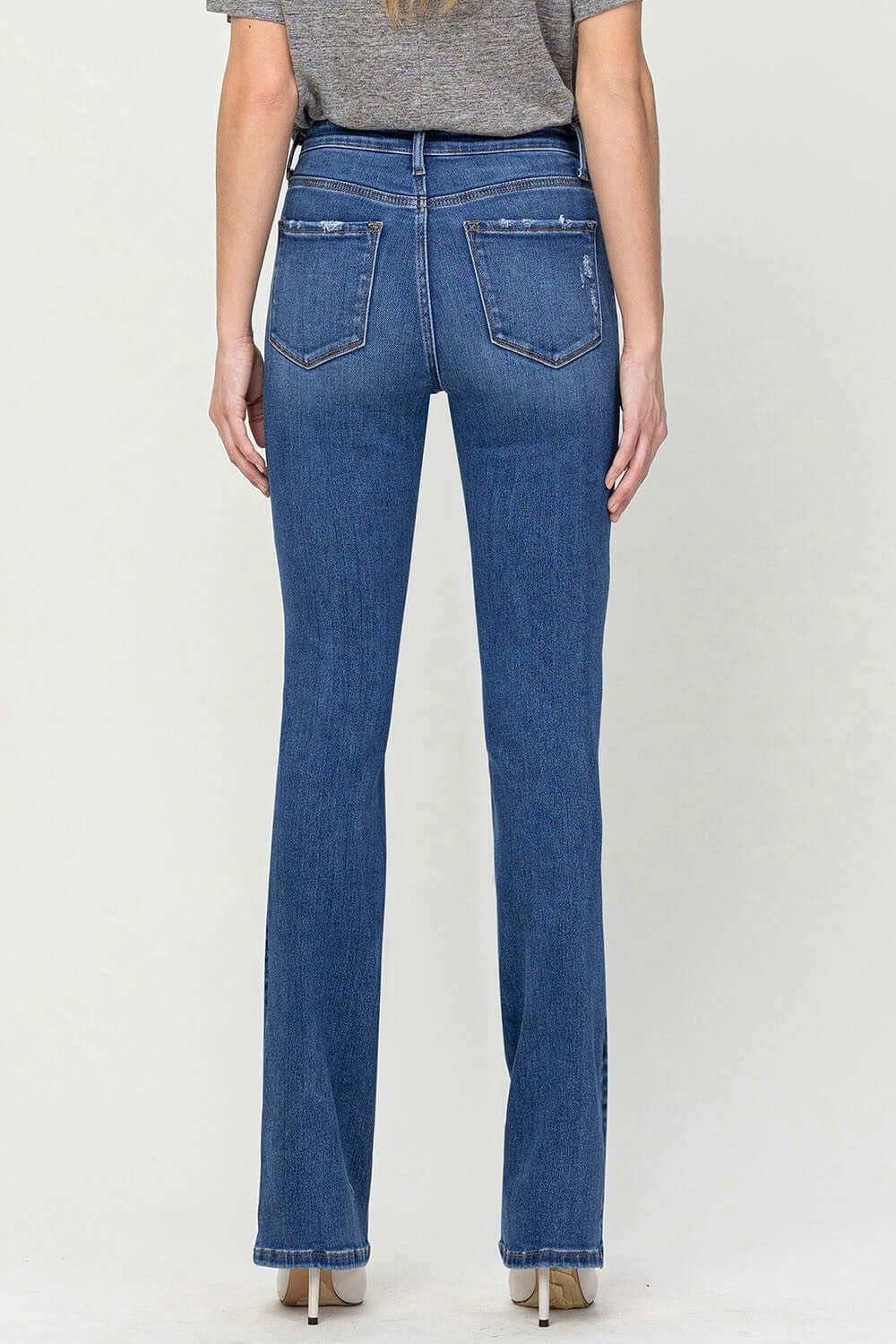 High Waist Bootcut Jeans in blue denim, viewed from the back, showing flattering high waist and sophisticated bootcut style.