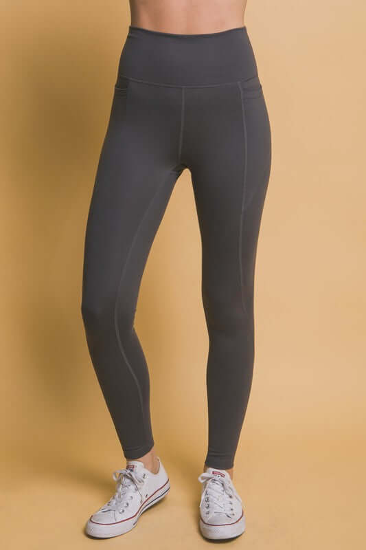 Love Tree high waist leggings in dark gray, featuring side pockets for essentials, perfect for workouts and casual outings.