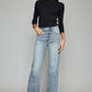 High Waist Raw Hem Cropped Wide Leg Jeans on model, featuring a trendy high waist design, wide leg style, and edgy raw hem detailing.