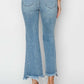 Back view of high rise frayed hem flare jeans. Trendy, flattering silhouette with a bohemian touch. Perfect for casual chan and stylish look. Risen Jeans.