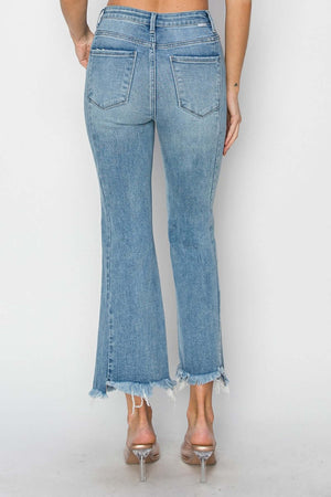 Back view of high rise frayed hem flare jeans. Trendy, flattering silhouette with a bohemian touch. Perfect for casual chan and stylish look. Risen Jeans.