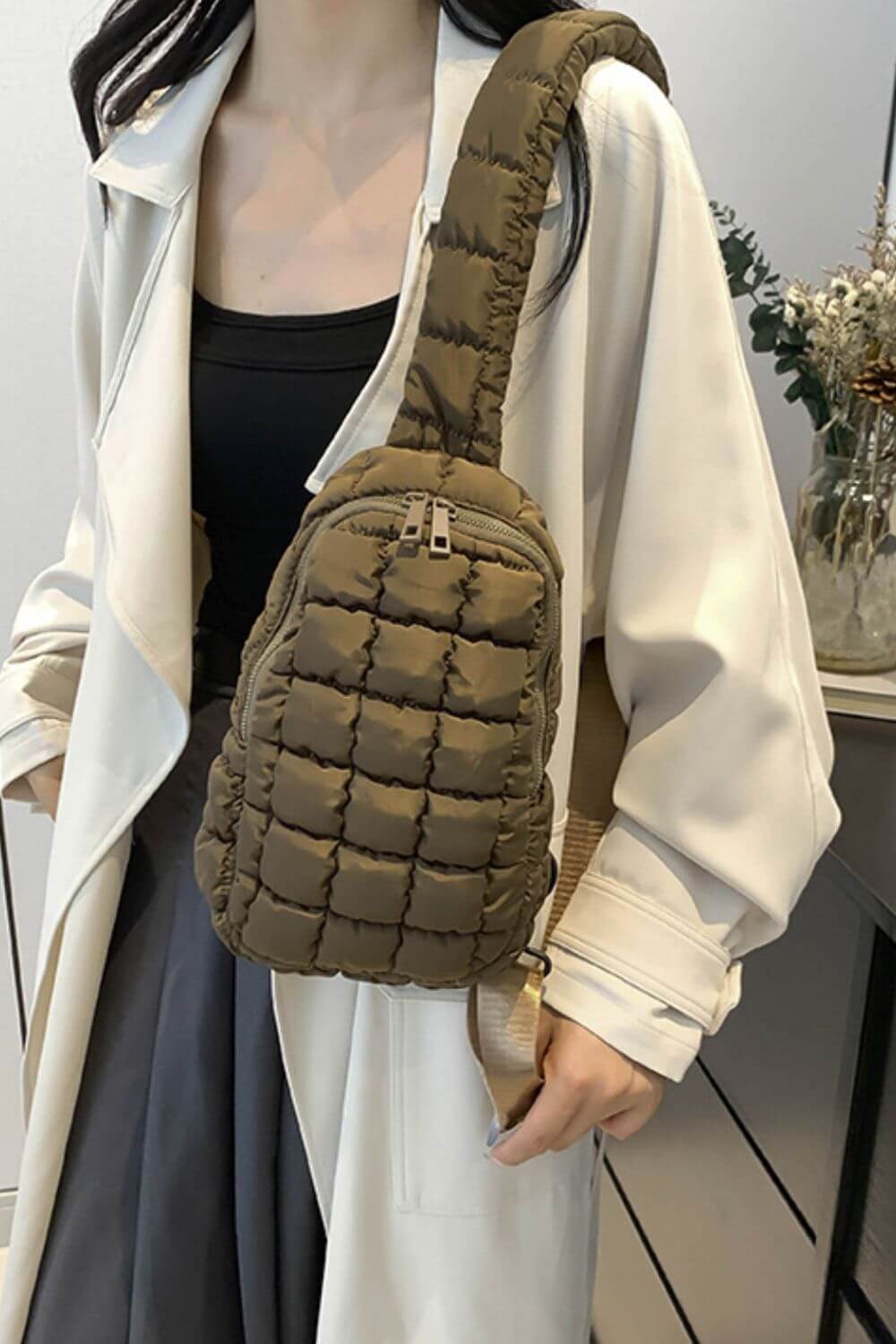 Olive Bella Road Quilted Nylon Crossbody Bag worn stylishly, perfect for trendy outfits and adventures. Lightweight, durable, medium size bag.