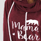 Close-up of maroon drawstring hoodie with "Mama Bear" graphic and bear illustration.