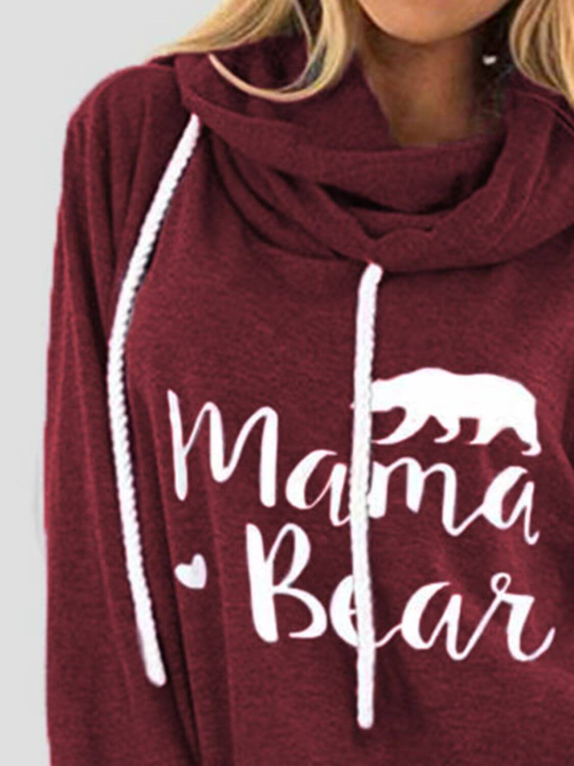 Close-up of maroon drawstring hoodie with "Mama Bear" graphic and bear illustration.