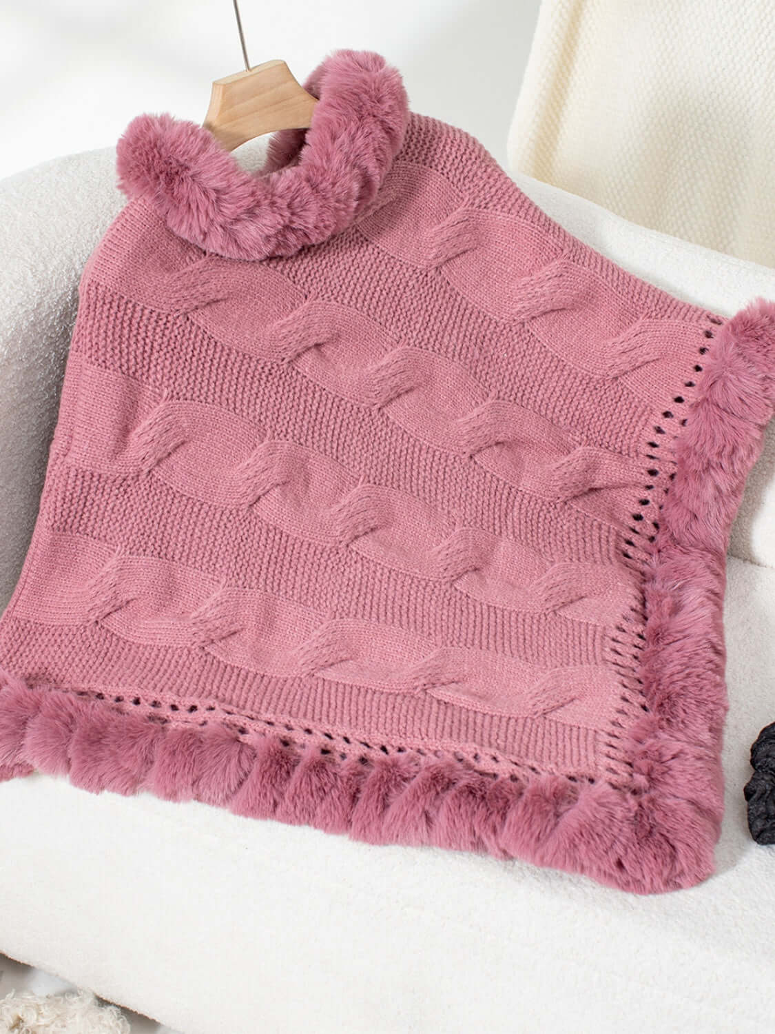 Bella Road Dusty Pink Cable-Knit Poncho with fuzzy hem, perfect for cozying up on chilly days.