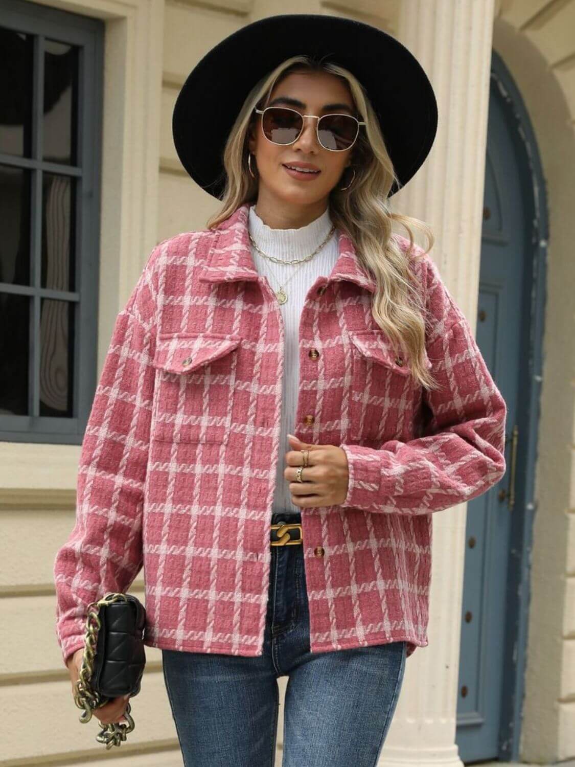 Woman wearing Bella Road Plaid Collared Neck Long Sleeve Jacket in pink, paired with jeans, a white knit sweater, sunglasses, and a black hat.