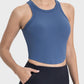 Millennia blue round neck racerback active tank, perfect for workouts with moderate stretch and a sleek fit.