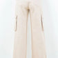 Back view of American Bazi full size drawstring wide leg cargo pants in beige with stylish cargo pockets.