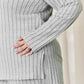 Ribbed high-low top and wide leg pants set in gray, close-up of model showing side slit and ribbed texture.