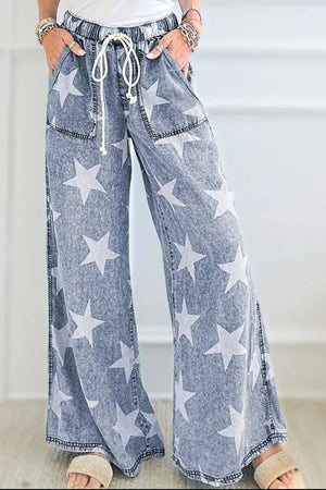 Woman wearing Drawstring Star Wide Leg Jeans with playful star print and slightly stretchy material - perfect for fun and stylish fashion statements.