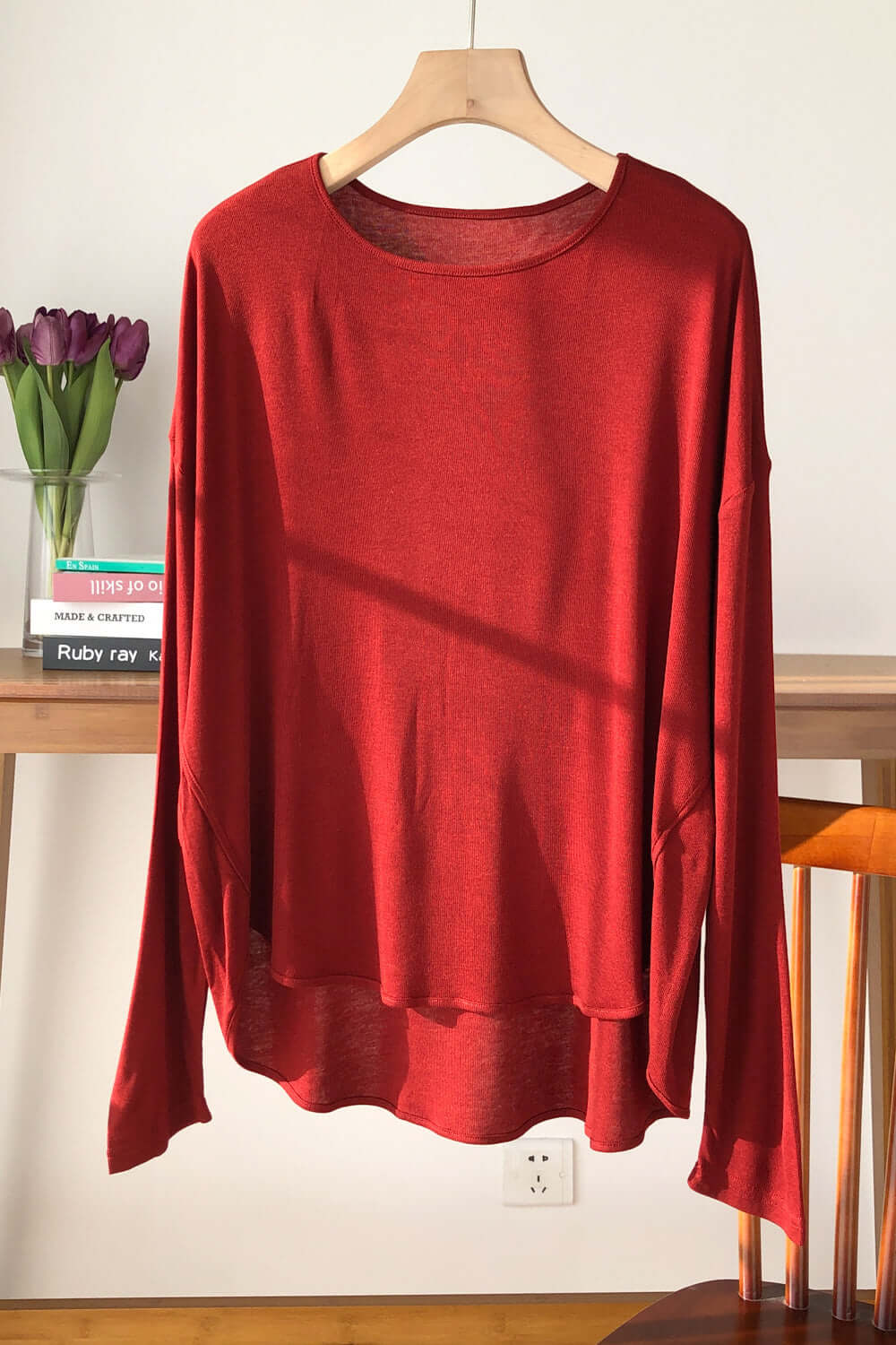 Trendy rust Basic Bae High-Low Long Sleeve T-Shirt on hanger in cozy room setting