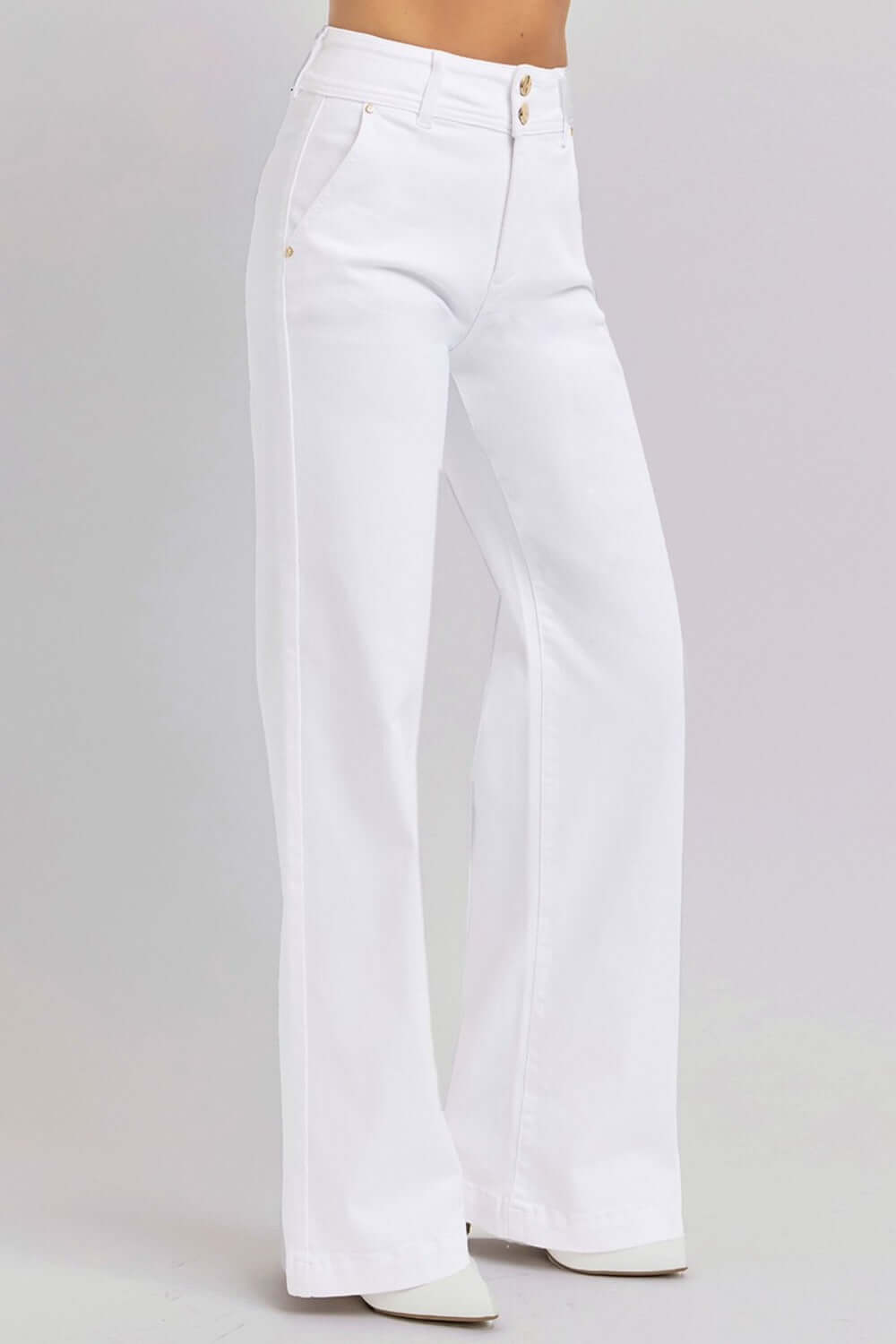 White high-rise tummy control wide leg jeans with double button closure, showcasing a chic and relaxed fit.