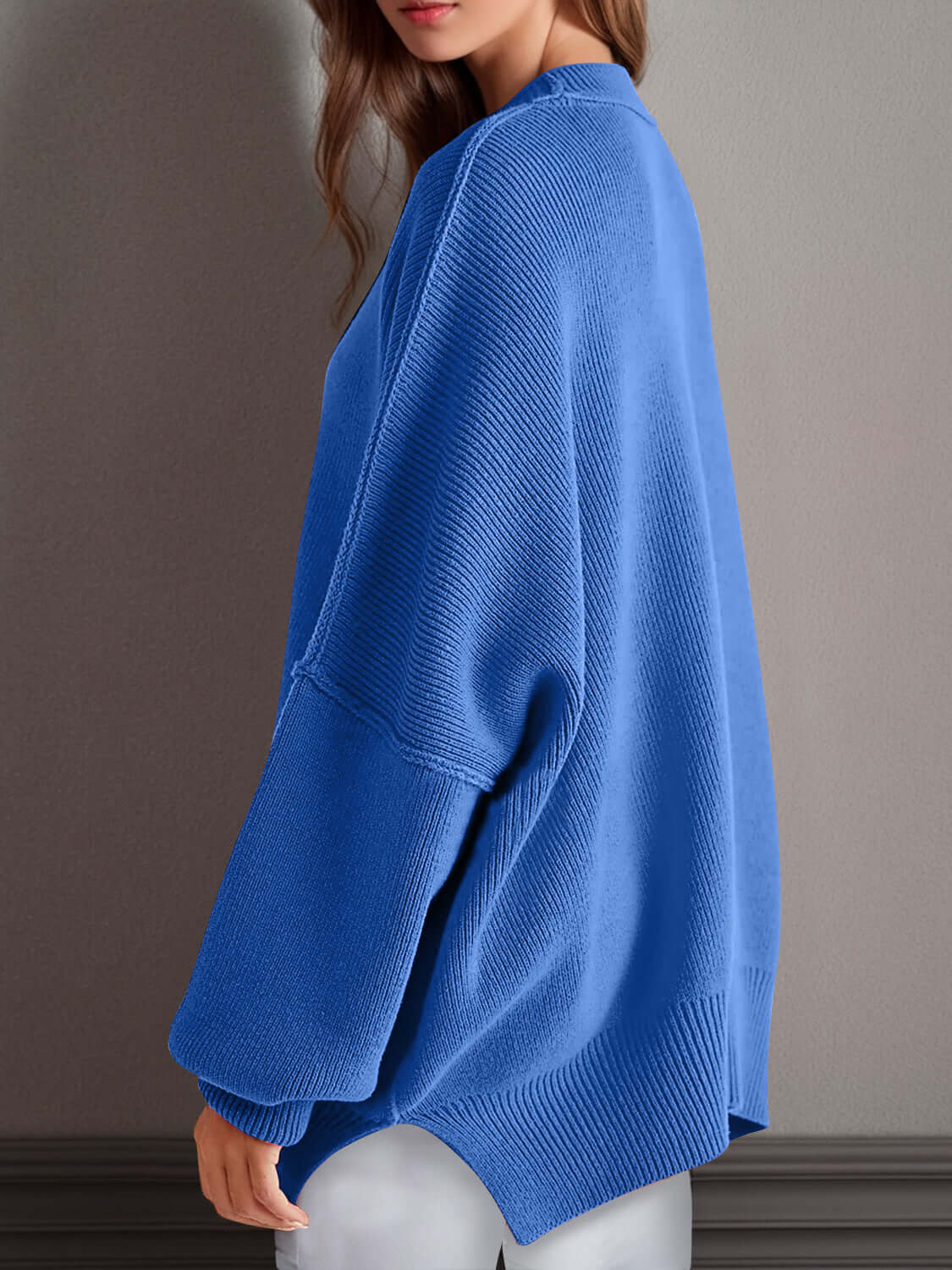 Double Take Side Slit Round Neck Long Sleeve Sweater in blue with a playful side slit design for a cozy and fun look.